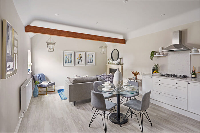Professionally staged home by Beau Property Home Staging. Show home kitchen featuring colour matched/themed furniture, dining set and living accessories