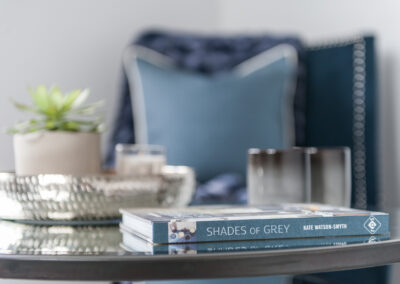 Professionally staged home by Beau Property Home Staging. close up of book on coffee table