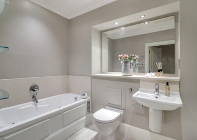 Professionally staged home by Beau Property Home Staging. Show home bathroom featuring ornaments and plants