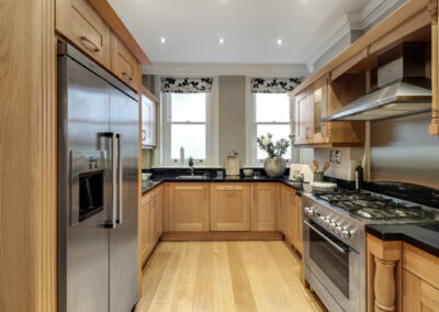 Professionally staged home by Beau Property Home Staging. Show home kitchen featuring kitchenware and decorative ornaments