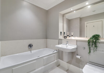 Professionally staged home by Beau Property Home Staging. Show home bathroom, featuring ornaments and plants