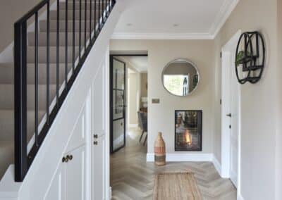 Stunning hallway with majestic staircase in a staged home in Tunbridge Wells, showcasing the elegance of home staging.